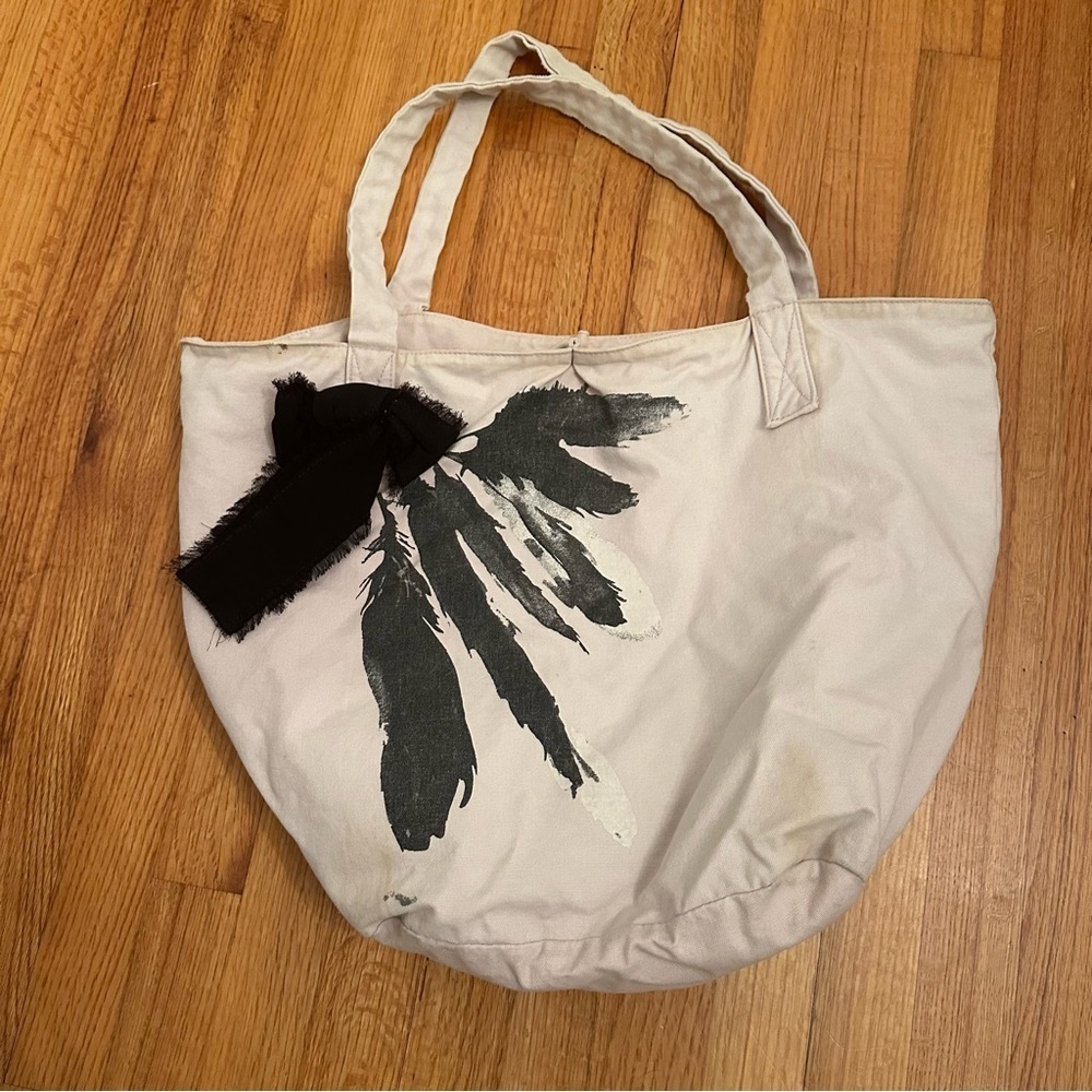 vintage Juicy Couture canvas tote bag with a black graphic and a black bow